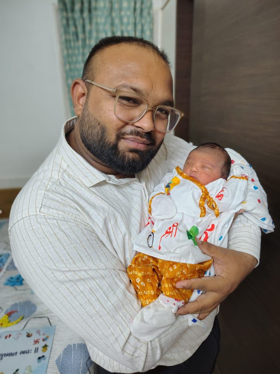 Father holding his newborn baby