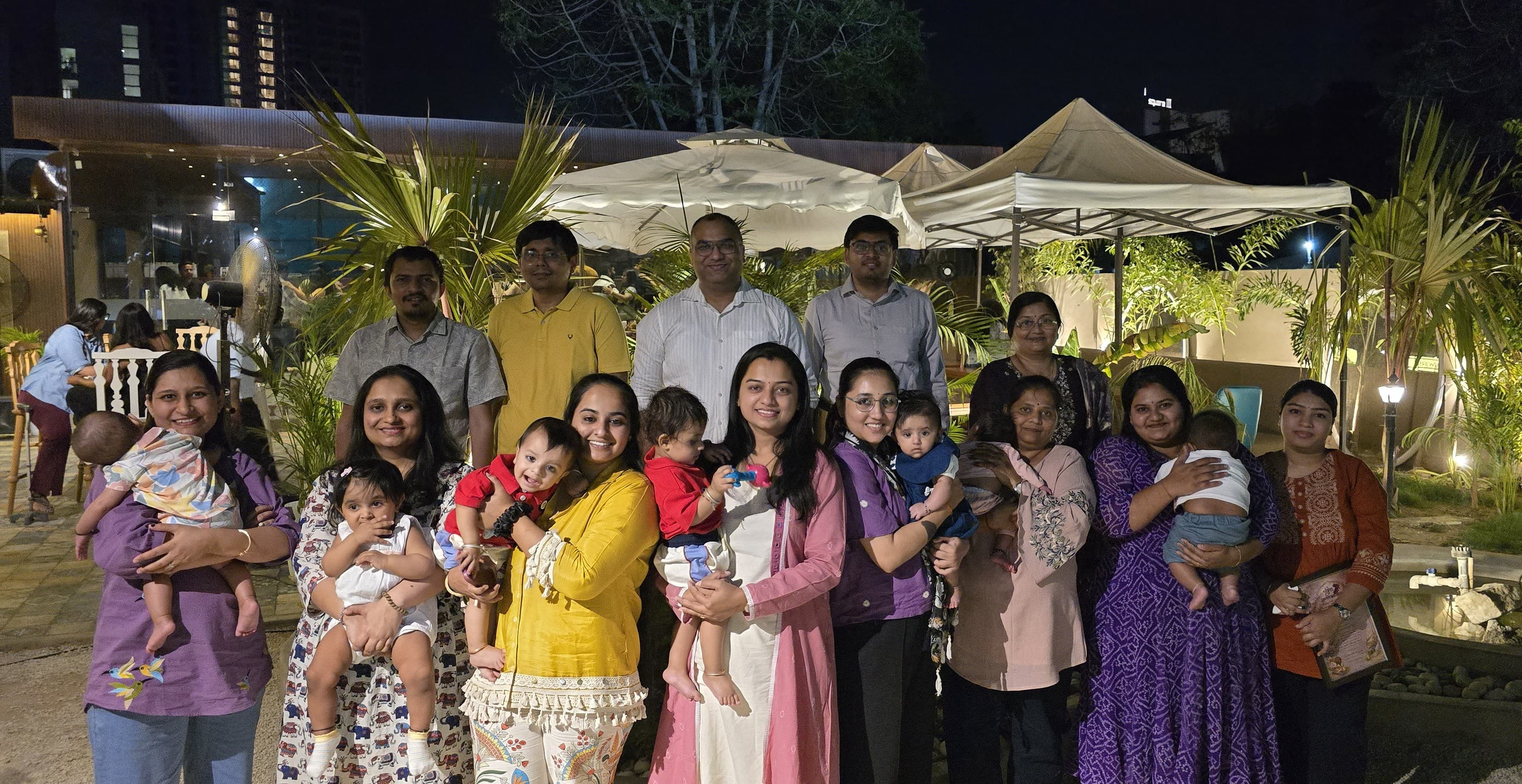 Srimad Garbh Sanskar families and team members at a community gathering
