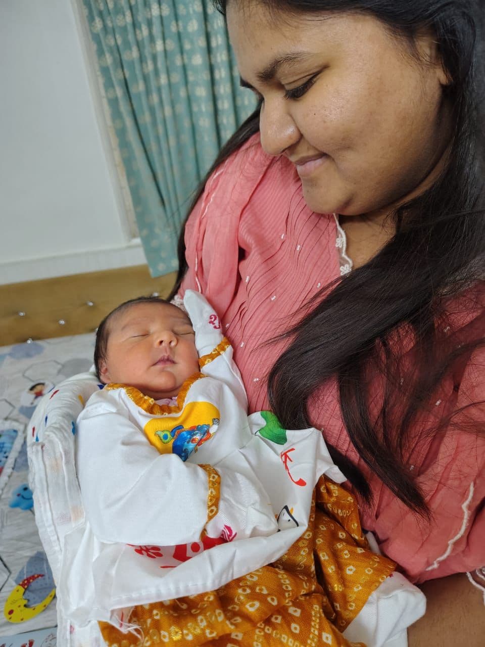 Mother holding her newborn baby